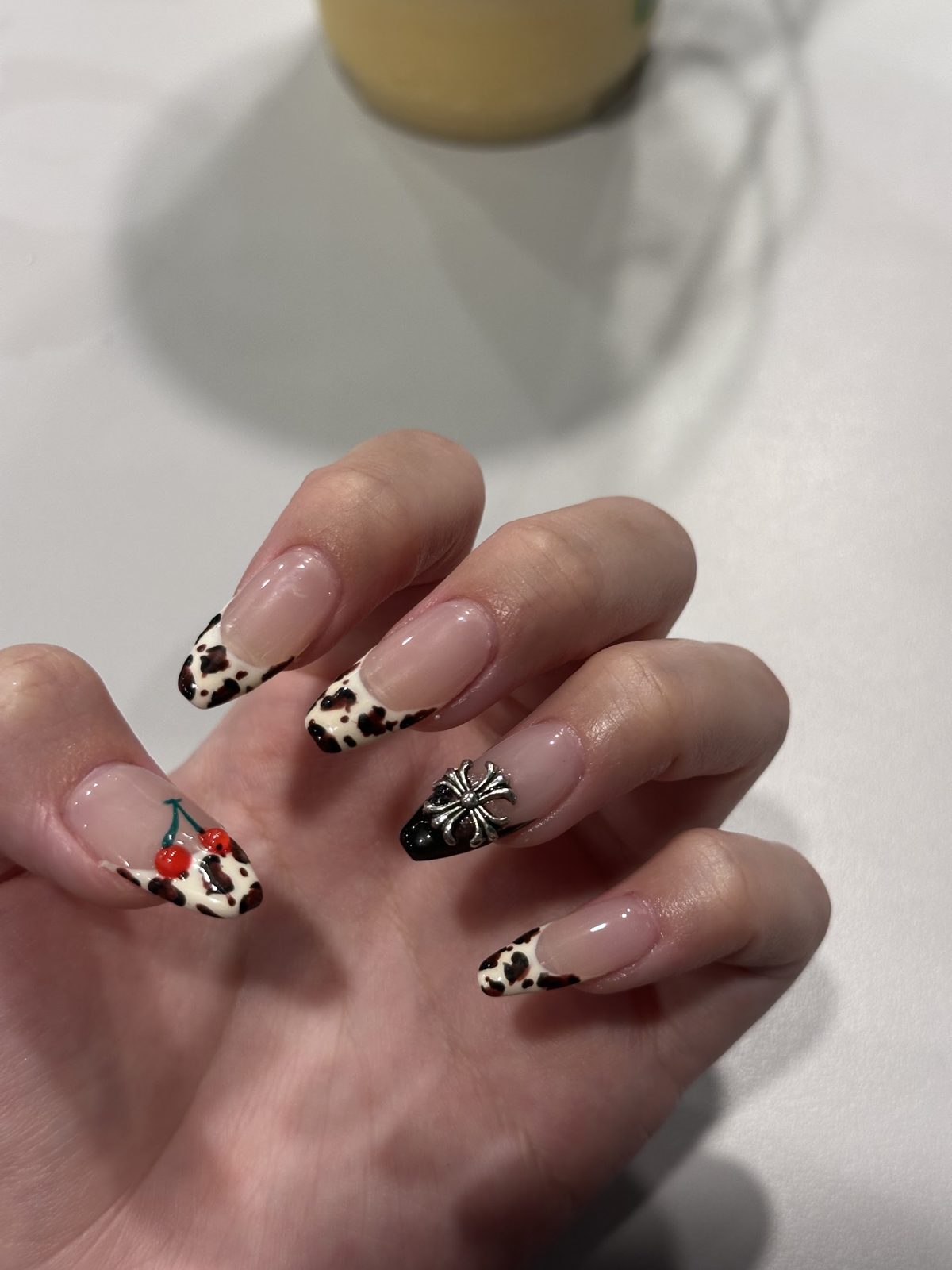 Leopard print French tips with a painted flower